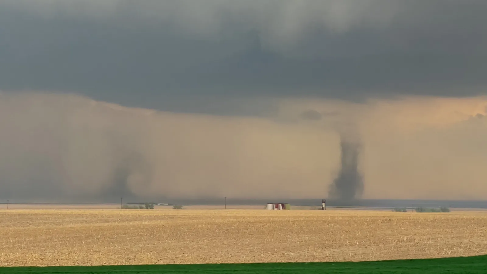 Land spout tornado and near-ground horizontal roll east of Denver, CO (photo credit Greg Robbin)