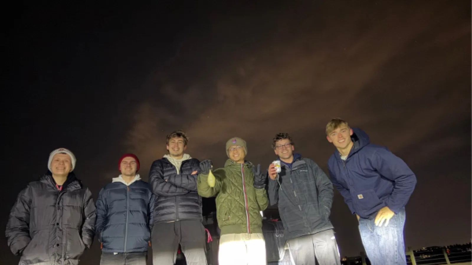 Students at night with weather balloons