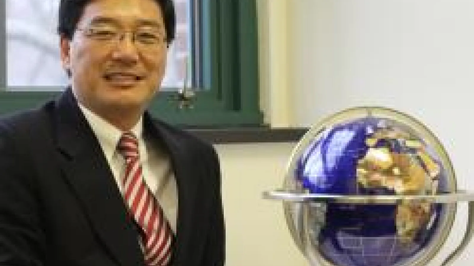 Dan Sui with globe