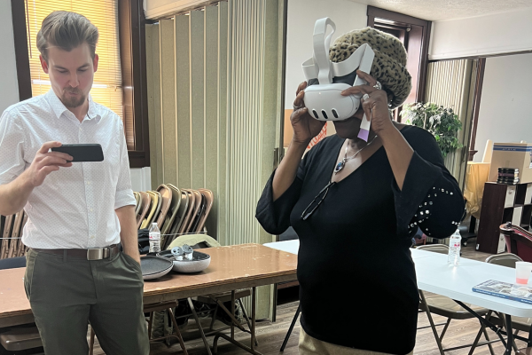 Adam Tjoelker demonstrates virtual reality headset