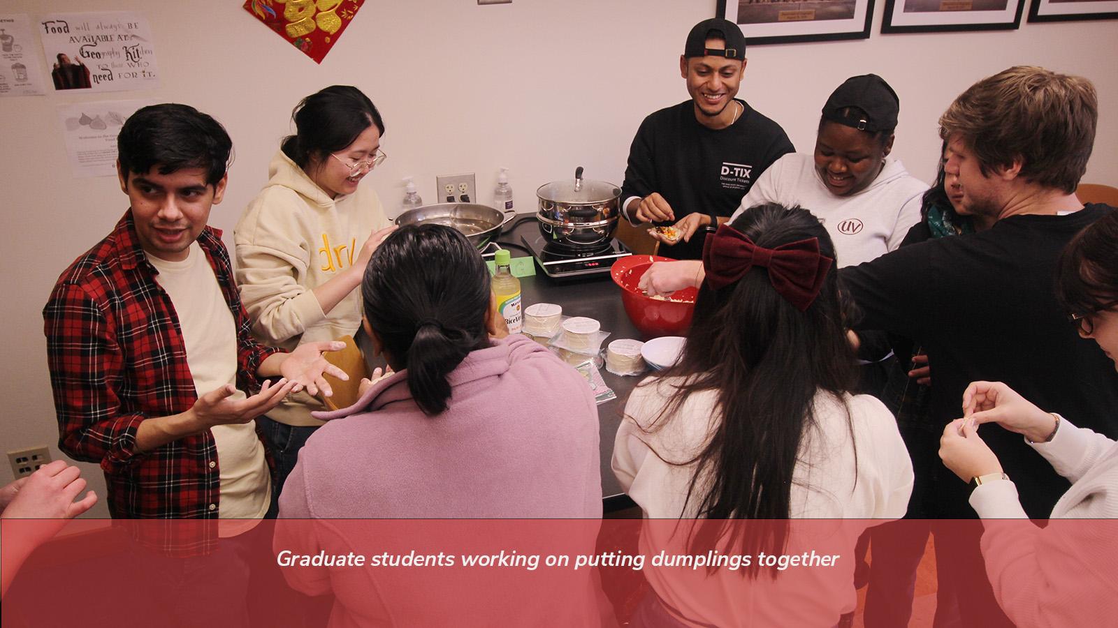 Graduate students working on putting dumplings together