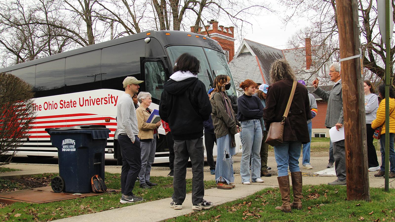 Photo of Ken Apacki talking to Ohio State students in the village of Alexandria, OH
