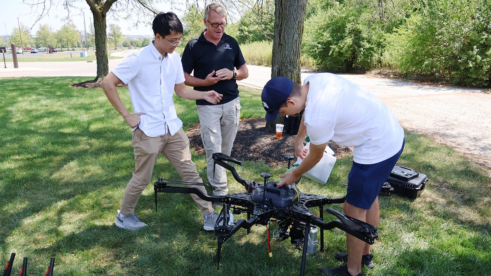 Adam Tjoelker and Sen Wang fueling Harris Aerial hybrid drone