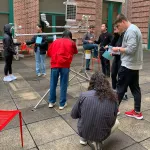 Students assembling instrumentation in Derby Hall atrium