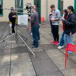 Students assembling instrumentation in Derby Hall atrium