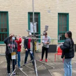 Students assembling instrumentation in Derby Hall atrium