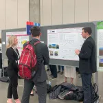 Erika Mrazik and Blake Murray discuss poster with AMS Attendee
