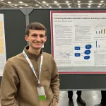 Ethan Hersey with his poster at AMS
