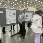 Jacob Fields with his poster at AMS