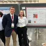 Sam Porter, Megan Schaffer, and Annie Giovannucci with their poster at AMS