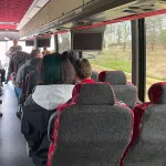 Ken Apacki presenting to students on bus