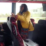Dr. Madhumita Dutta talking to students on bus