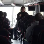 Dawn Burton talking to students on bus