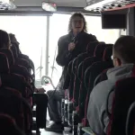 Dawn Burton talking to students on bus