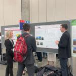 Erika Mrazik and Blake Murray discuss poster with AMS Attendee