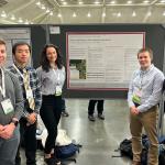 Andrew Kellman, Qi Tan, Anna Glodzik, Simon Tate, and Aleshly Castro with their poster at AMS