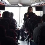 Dawn Burton talking to students on bus