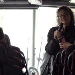Dawn Burton talking to students on bus