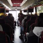 Dawn Burton talking to students on bus